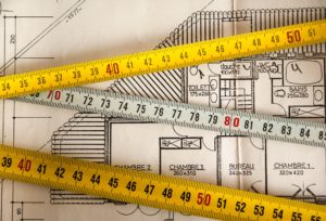 Construction plans with tape measures