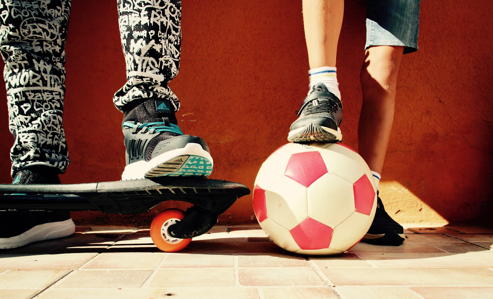 Skateboard and soccer ball